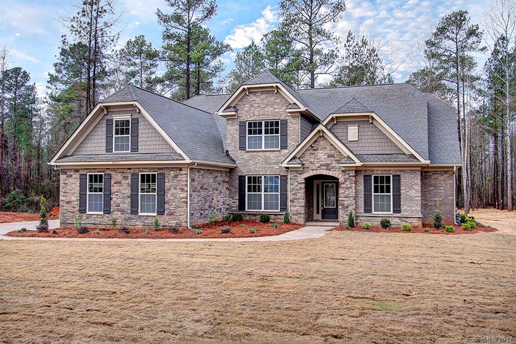 4933 River Oaks Road, Unit 113 Clover, SC 29710 - Photo 1 of 24 a front view of a house with a yard