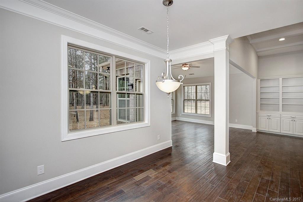 4933 River Oaks Road, Unit 113 Clover, SC 29710 - Photo 7 of 24 a view of a room with wooden floor and windows