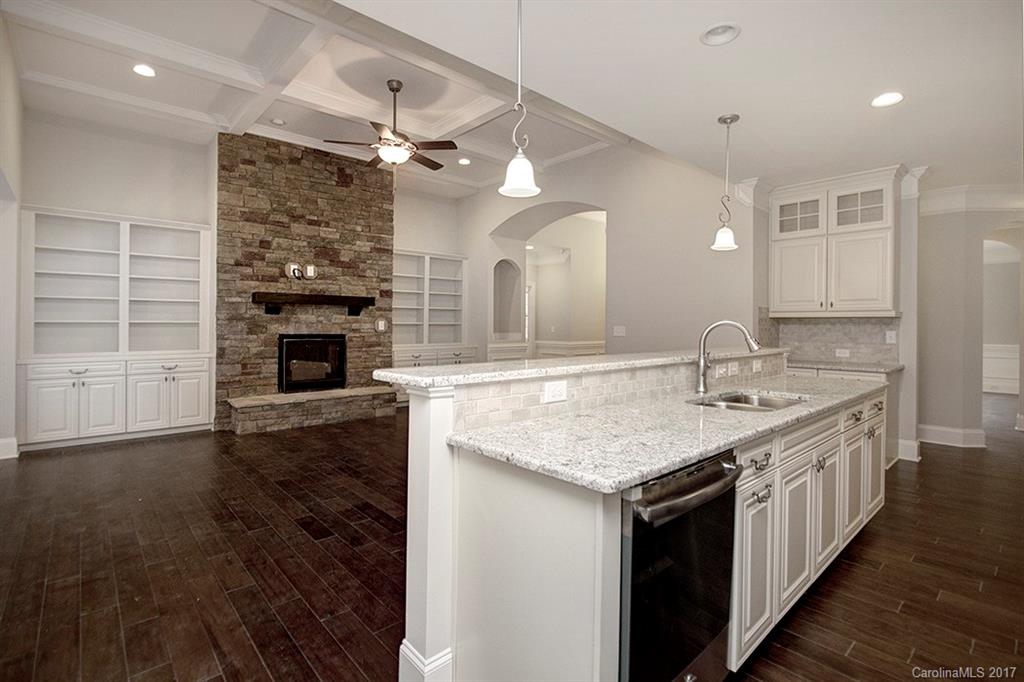 4933 River Oaks Road, Unit 113 Clover, SC 29710 - Photo 9 of 24 an open kitchen with a sink and a refrigerator