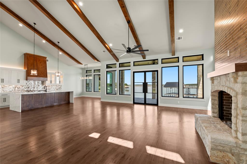 4054 Smothers Road Caney City, TX 75148 - Photo 4 of 40 Chef’s kitchen with oversized 10’ island overlooking the living area with bar seating.