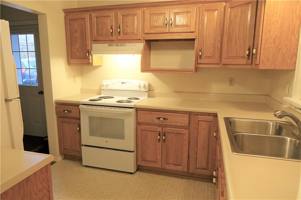 504 Chicora Road Butler, PA 16001 - Photo 9 of 24 Kitchen with custom made oak cabinetry and abundant countertop space. Stove and refrigerator included.