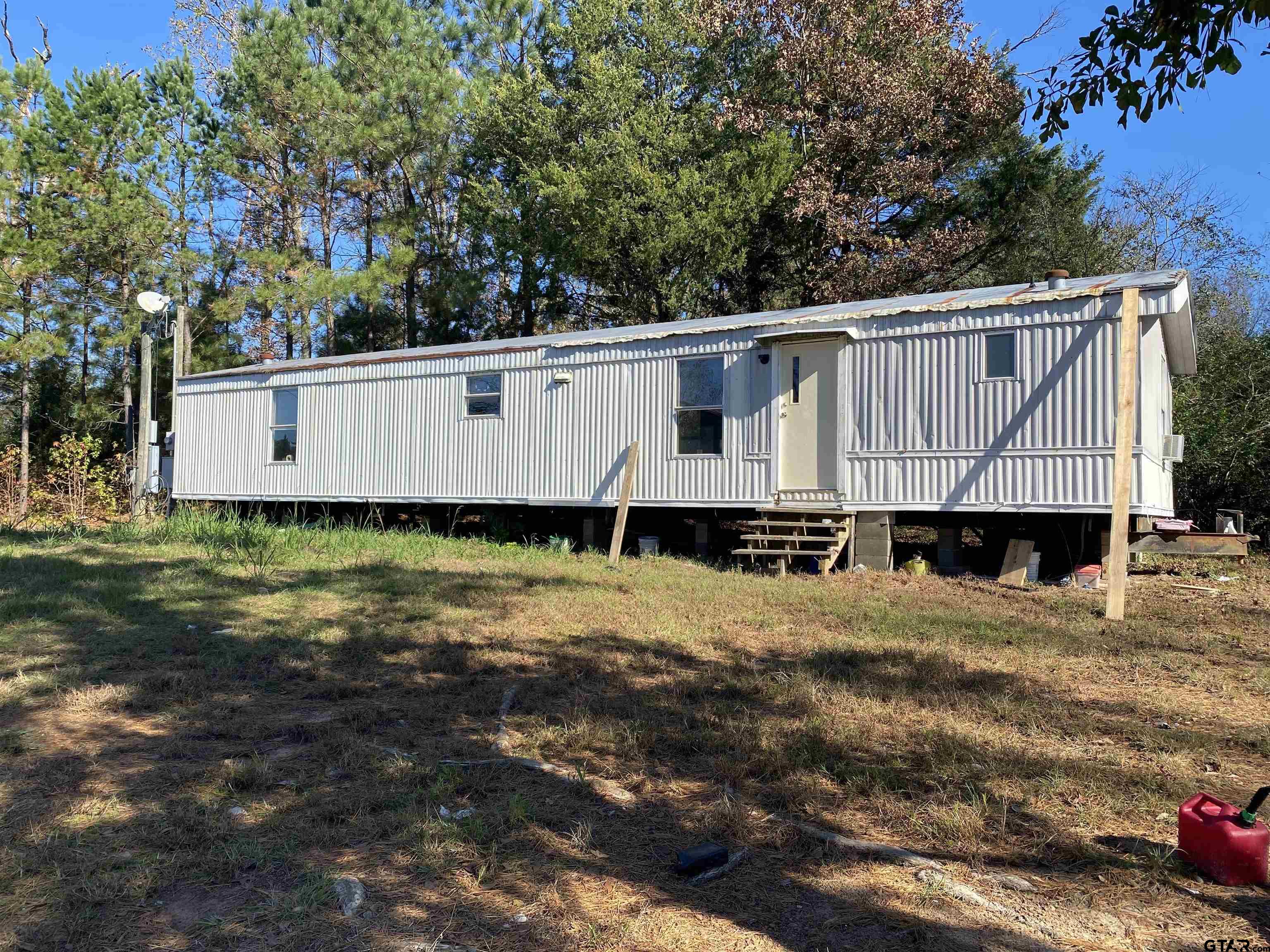 a house with trees in front of it