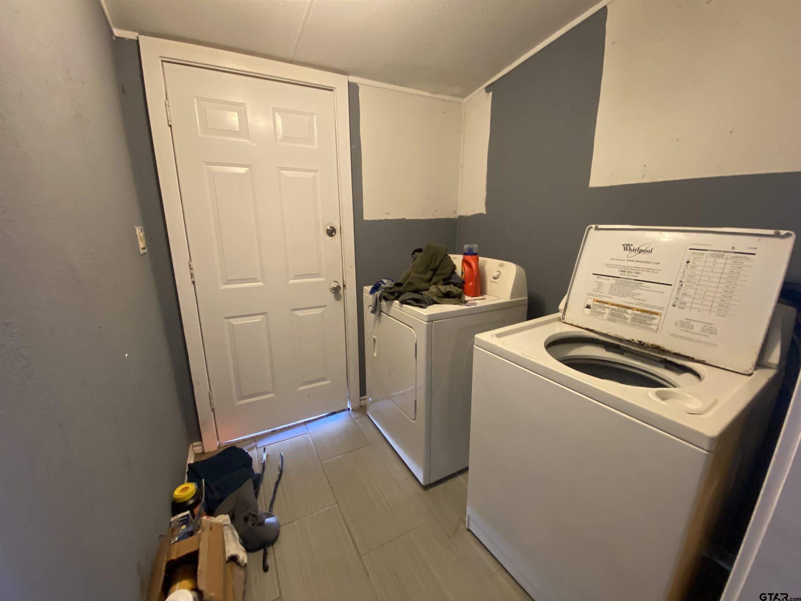 7761 Fm 1251 Henderson, TX 75652 - Photo 16 of 29 a utility room with dryer and washer