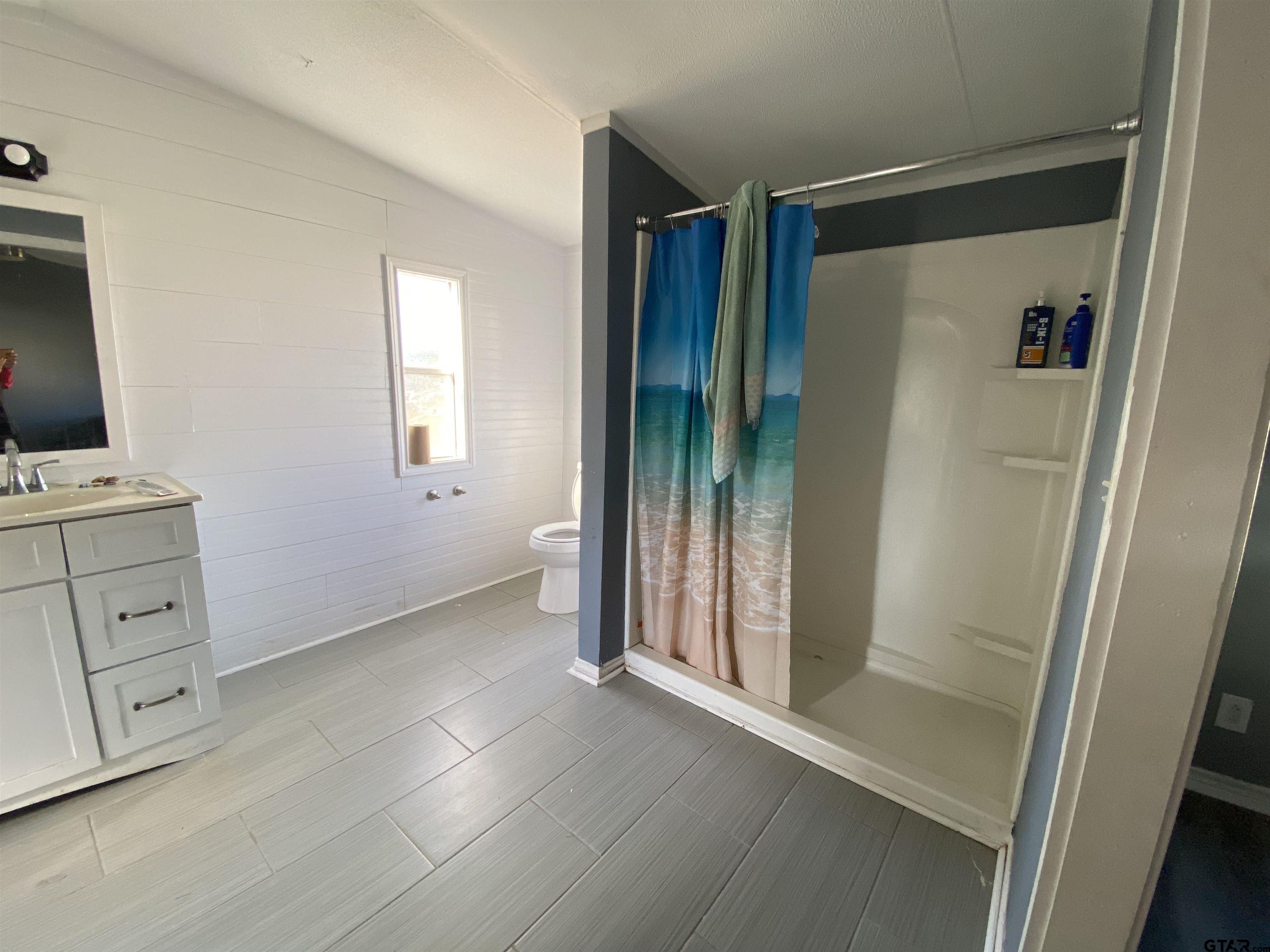 7761 Fm 1251 Henderson, TX 75652 - Photo 18 of 29 a view of walk in closet with window