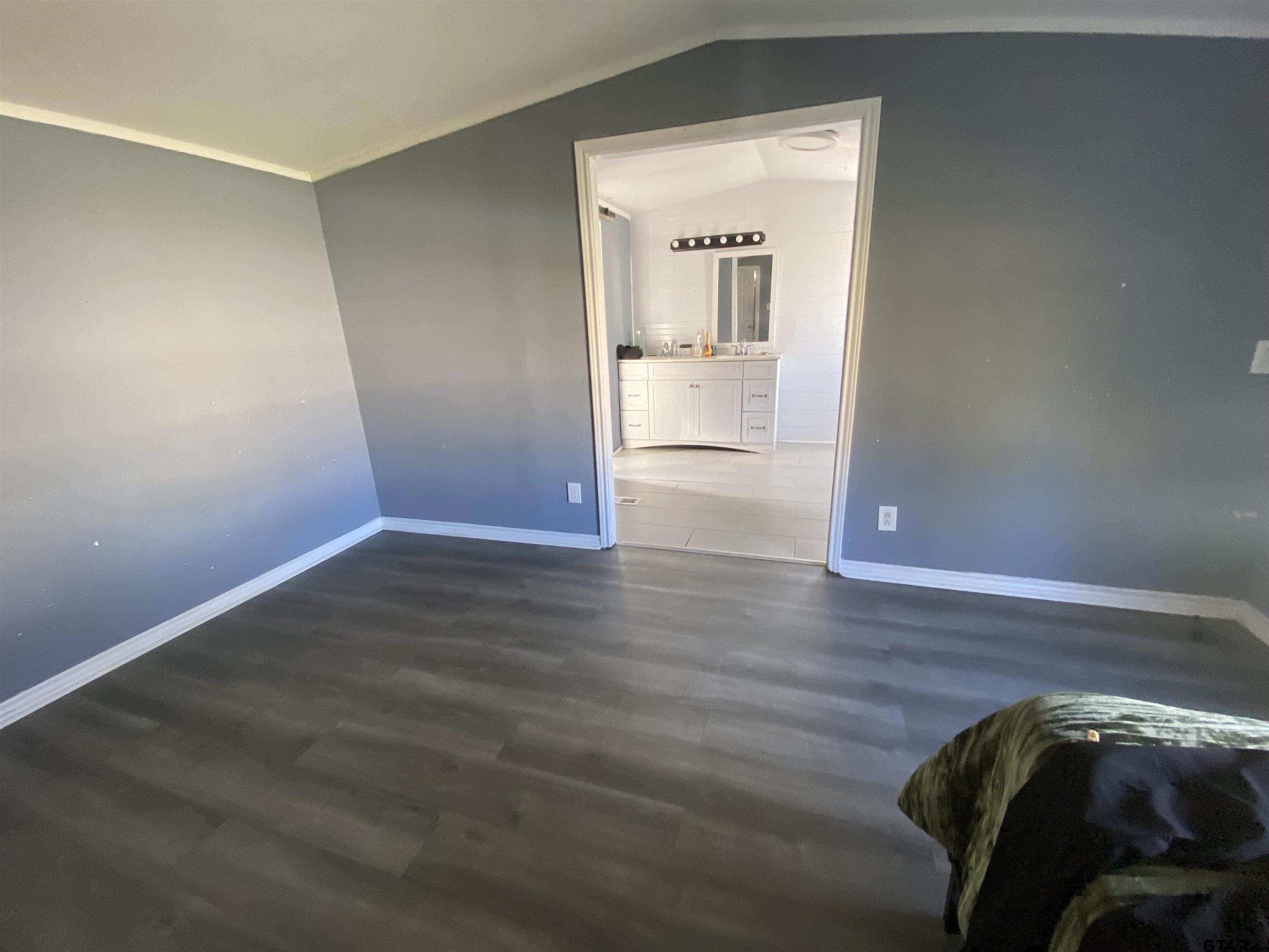 7761 Fm 1251 Henderson, TX 75652 - Photo 21 of 29 a view of a hallway with wooden floor