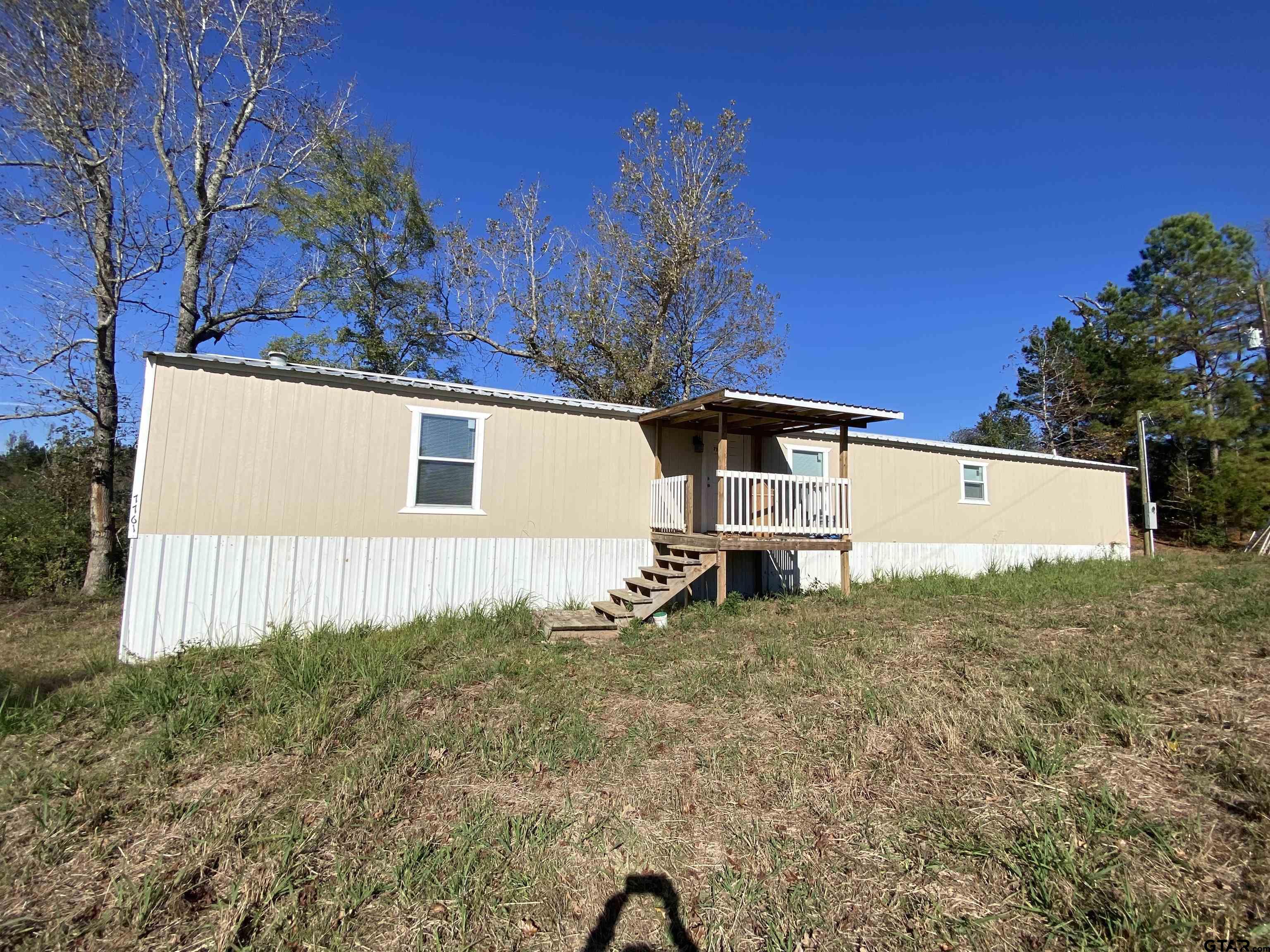 7761 Fm 1251 Henderson, TX 75652 - Photo 22 of 29 a view of a house with a yard