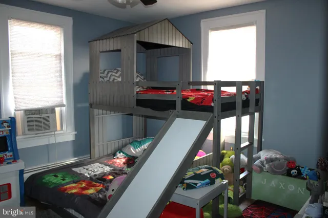 a bedroom with bed and a window