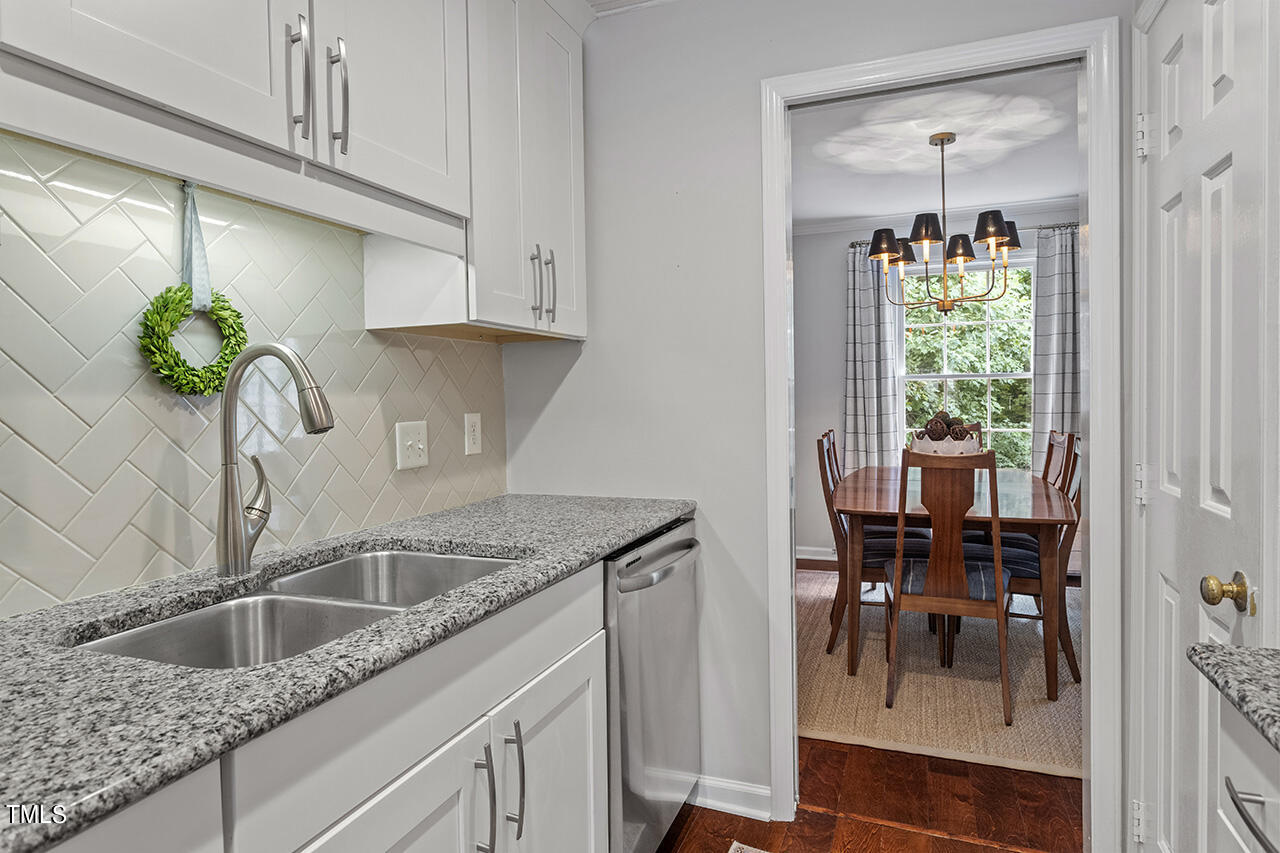 2826 Wycliff Road Raleigh, NC 27607 - Photo 12 of 43 a kitchen with a sink and cabinets