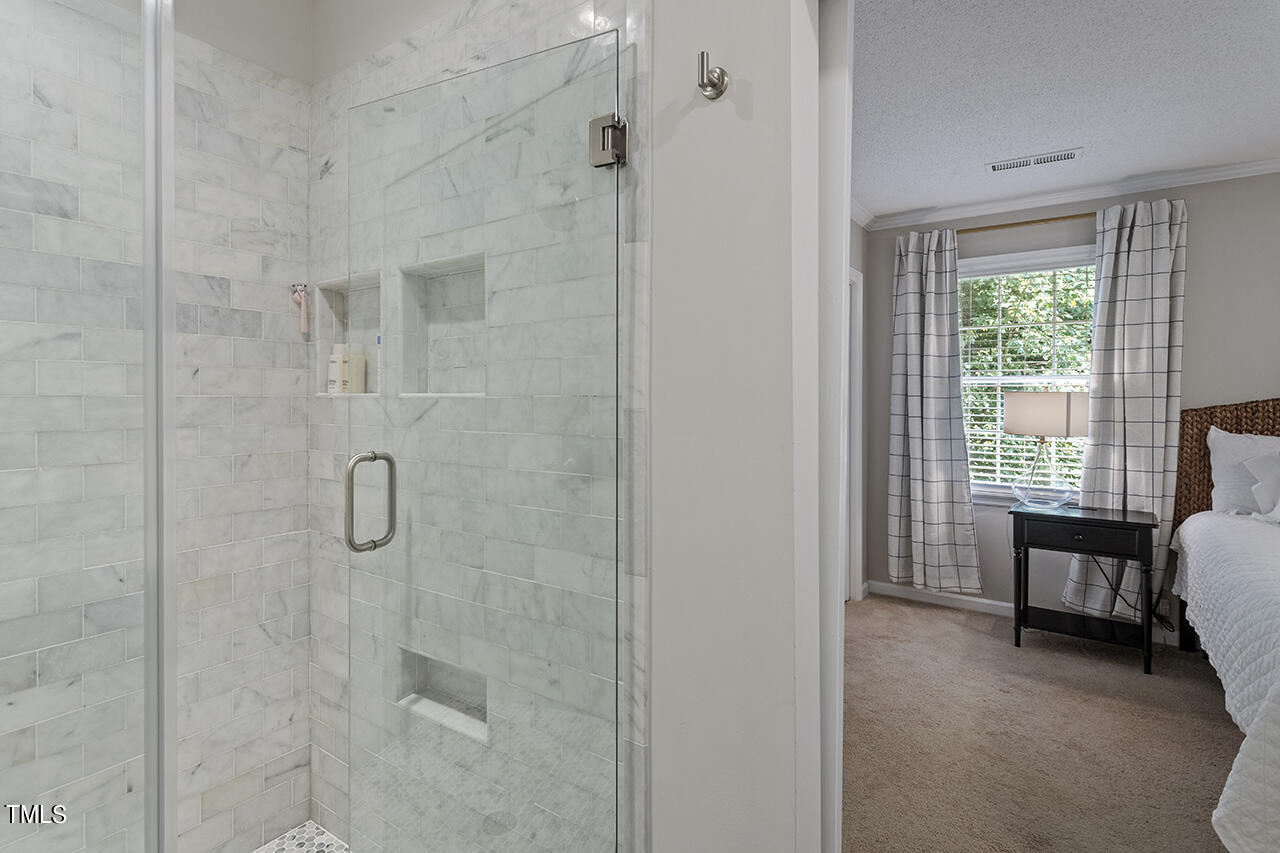 2826 Wycliff Road Raleigh, NC 27607 - Photo 40 of 43 a bathroom with a sink and a shower
