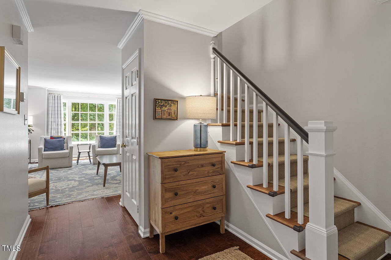 2826 Wycliff Road Raleigh, NC 27607 - Photo 4 of 43 a view of hallway with wooden floor and staircase