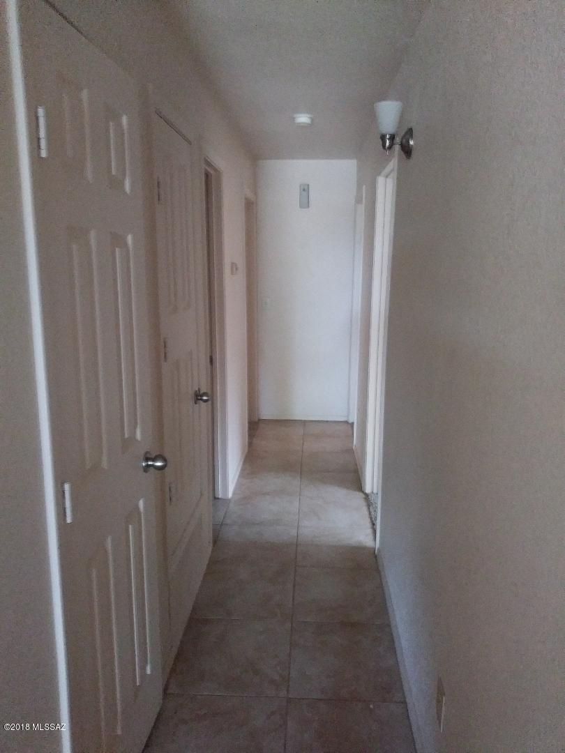 423 Teson Court Rio Rico, AZ 85648 - Photo 6 of 13 a view of a hallway with closet area