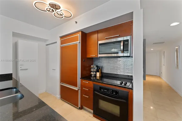 a kitchen with a stove and a microwave