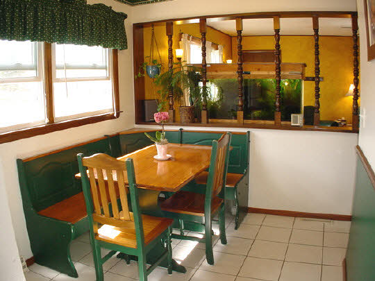 902 Lakeview Drive Rochelle, IL 61068 - Photo 7 of 10 a view of a dining room with furniture large windows and wooden floor