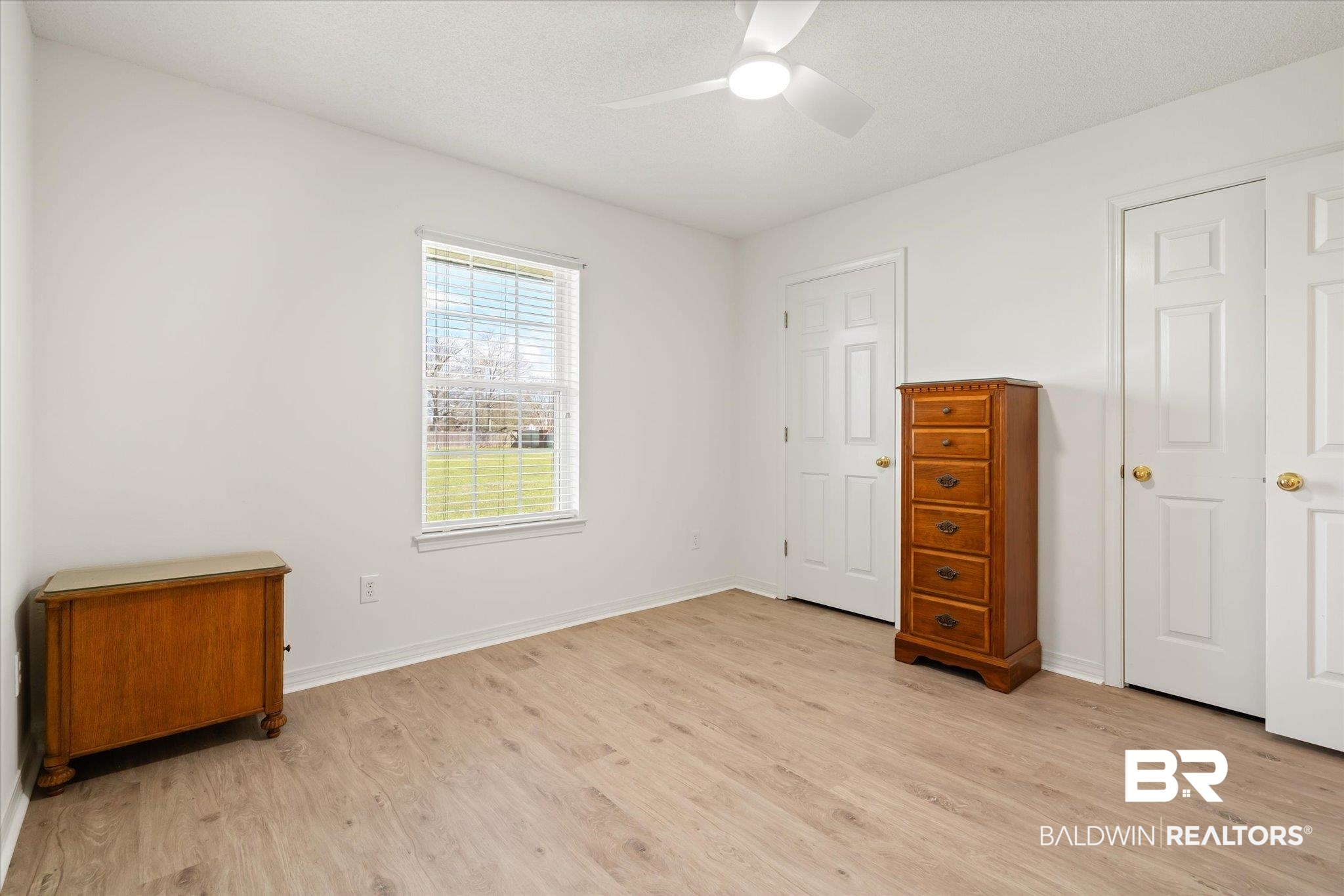 12520 Hunters Chase Foley, AL 36535 - Photo 26 of 32 Bedroom featuring light wood-style flooring, a ceiling fan, and baseboards