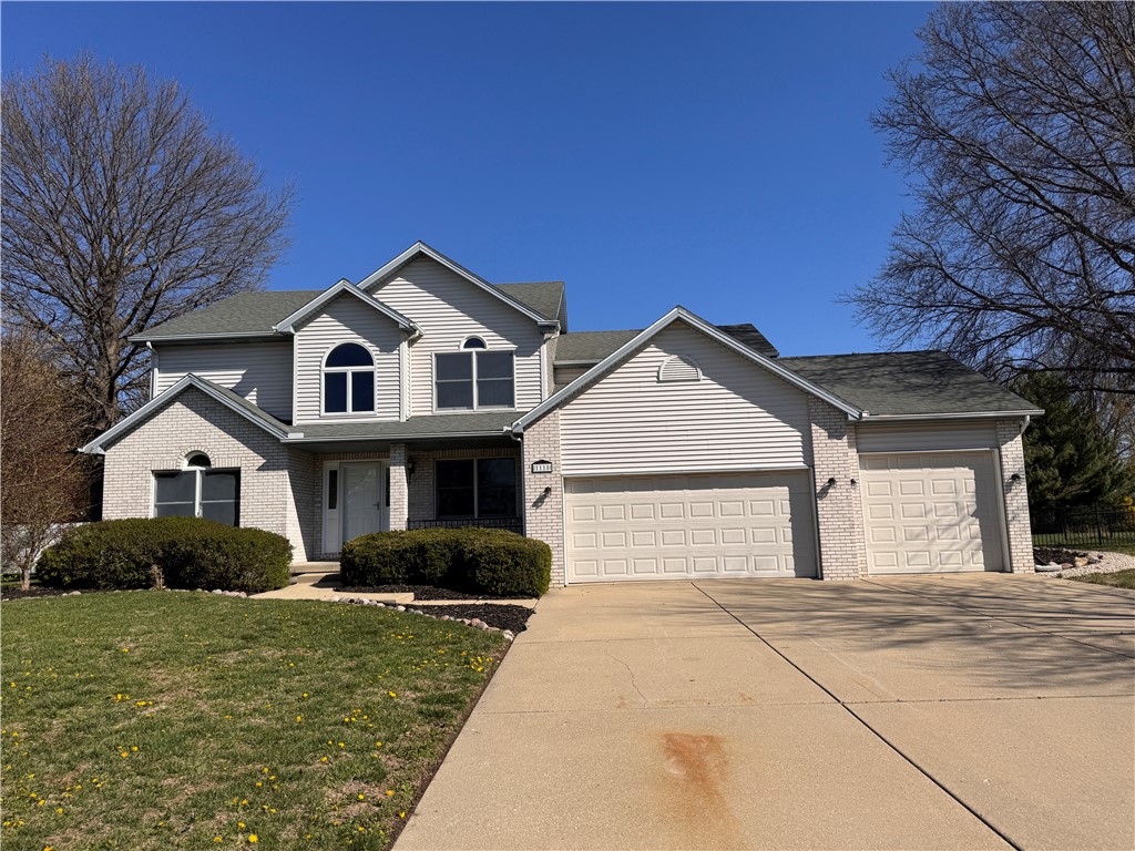 1118 Wedgewood Court Decatur, IL 62526 - Photo 1 of 22 a front view of a house with garden