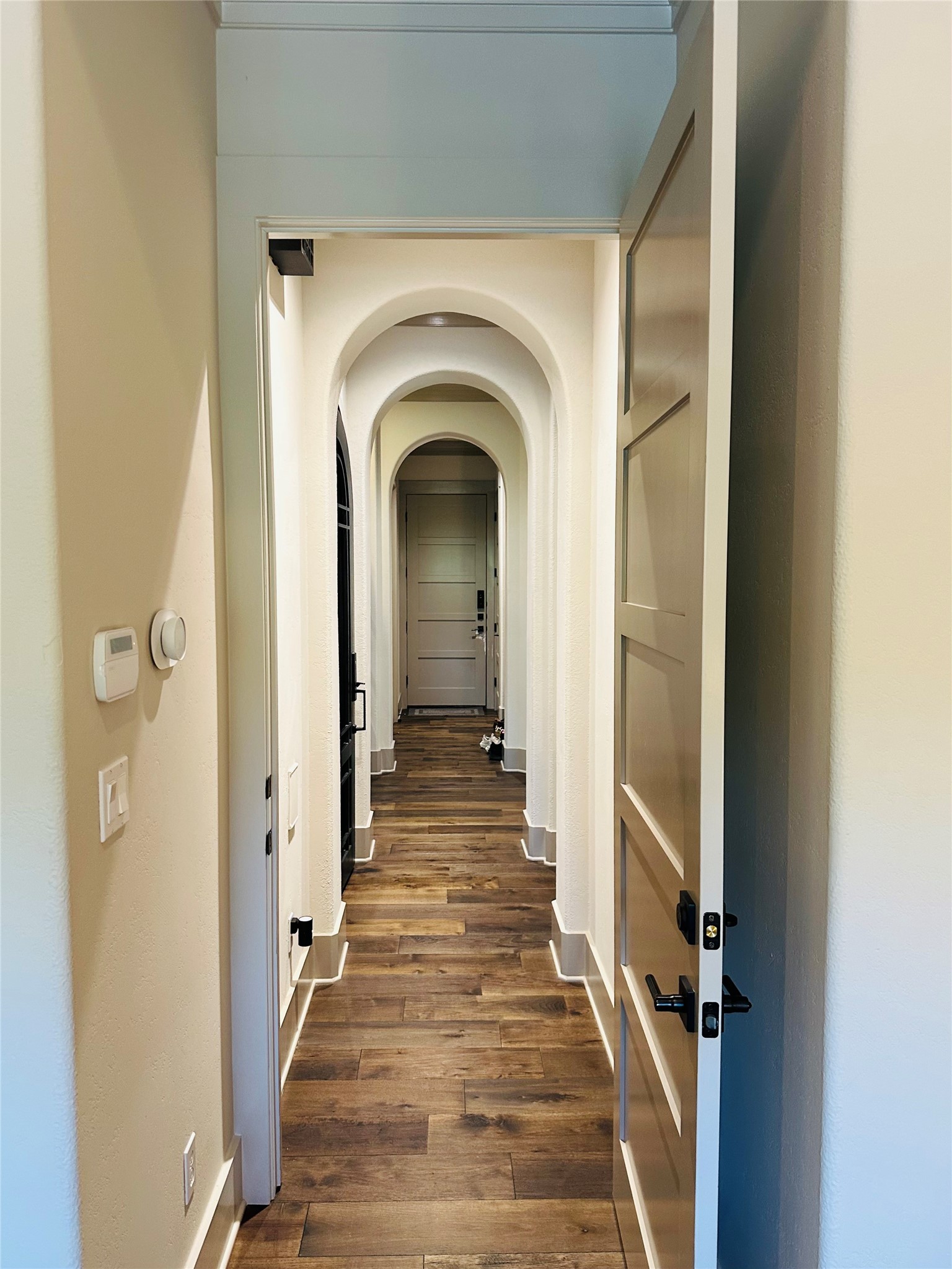 2753 Springwood Lane Georgetown, TX 78628 - Photo 26 of 40 a view of a hallway with wooden floor and staircase
