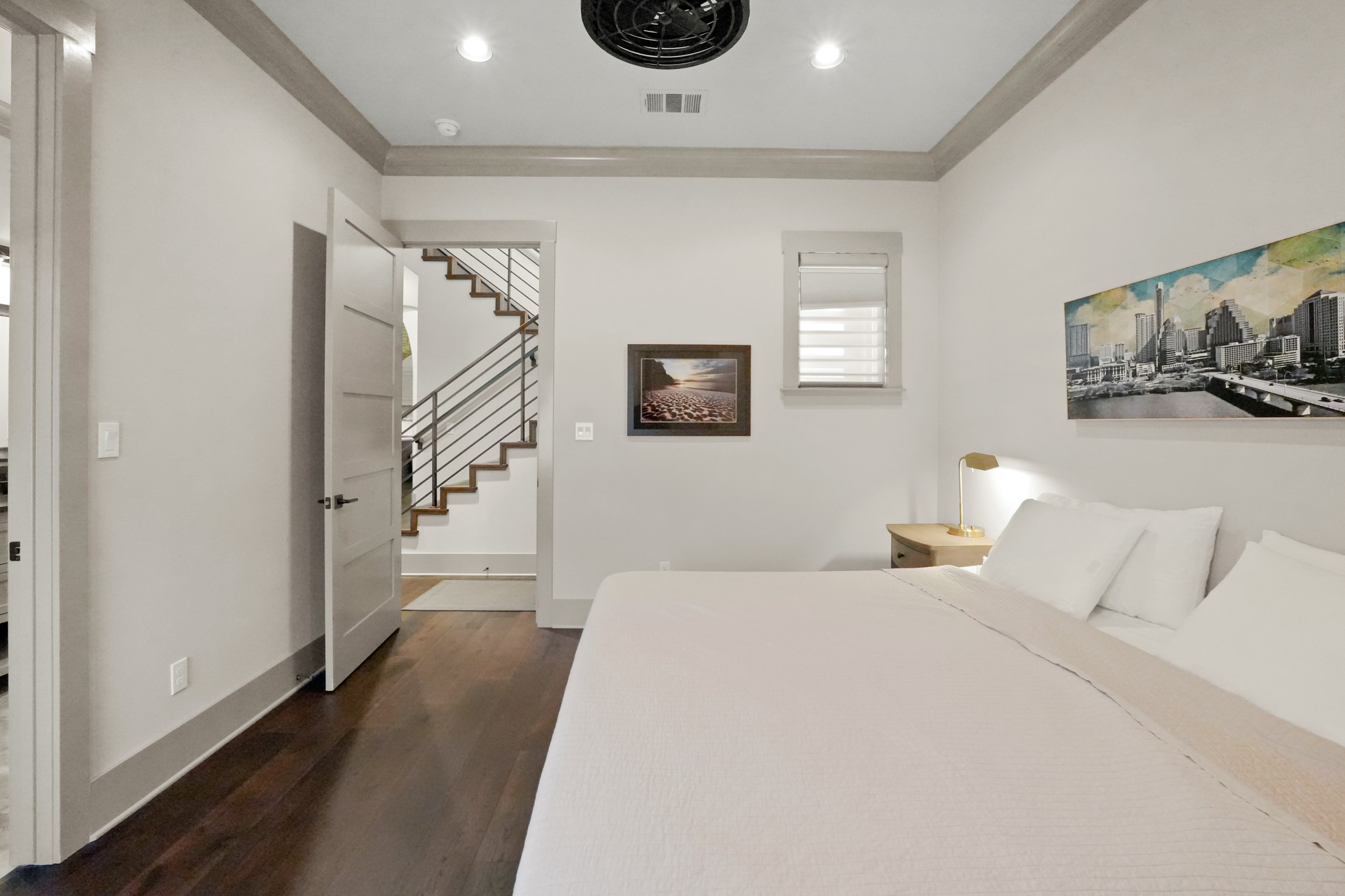 2753 Springwood Lane Georgetown, TX 78628 - Photo 28 of 40 a bedroom with a bed and wooden floor