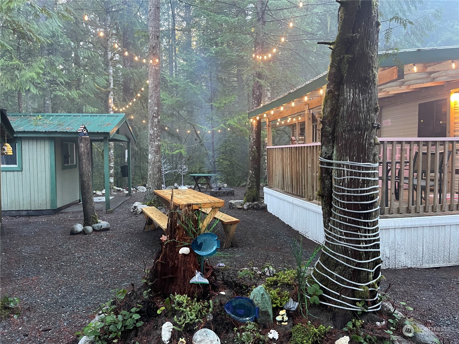 18 Drial Loop Maple Falls, WA 98266 - Photo 11 of 39 a backyard of a house with table and chairs