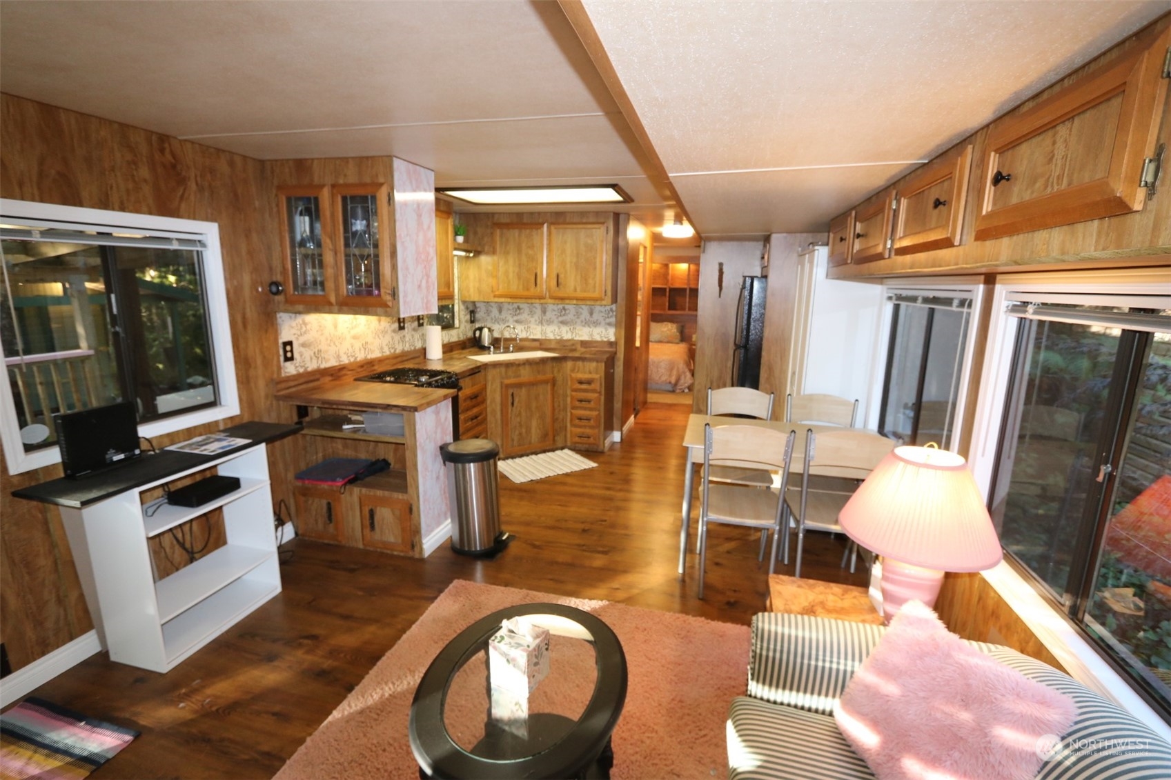 18 Drial Loop Maple Falls, WA 98266 - Photo 17 of 39 a living room with furniture a flat screen tv and floor to ceiling window