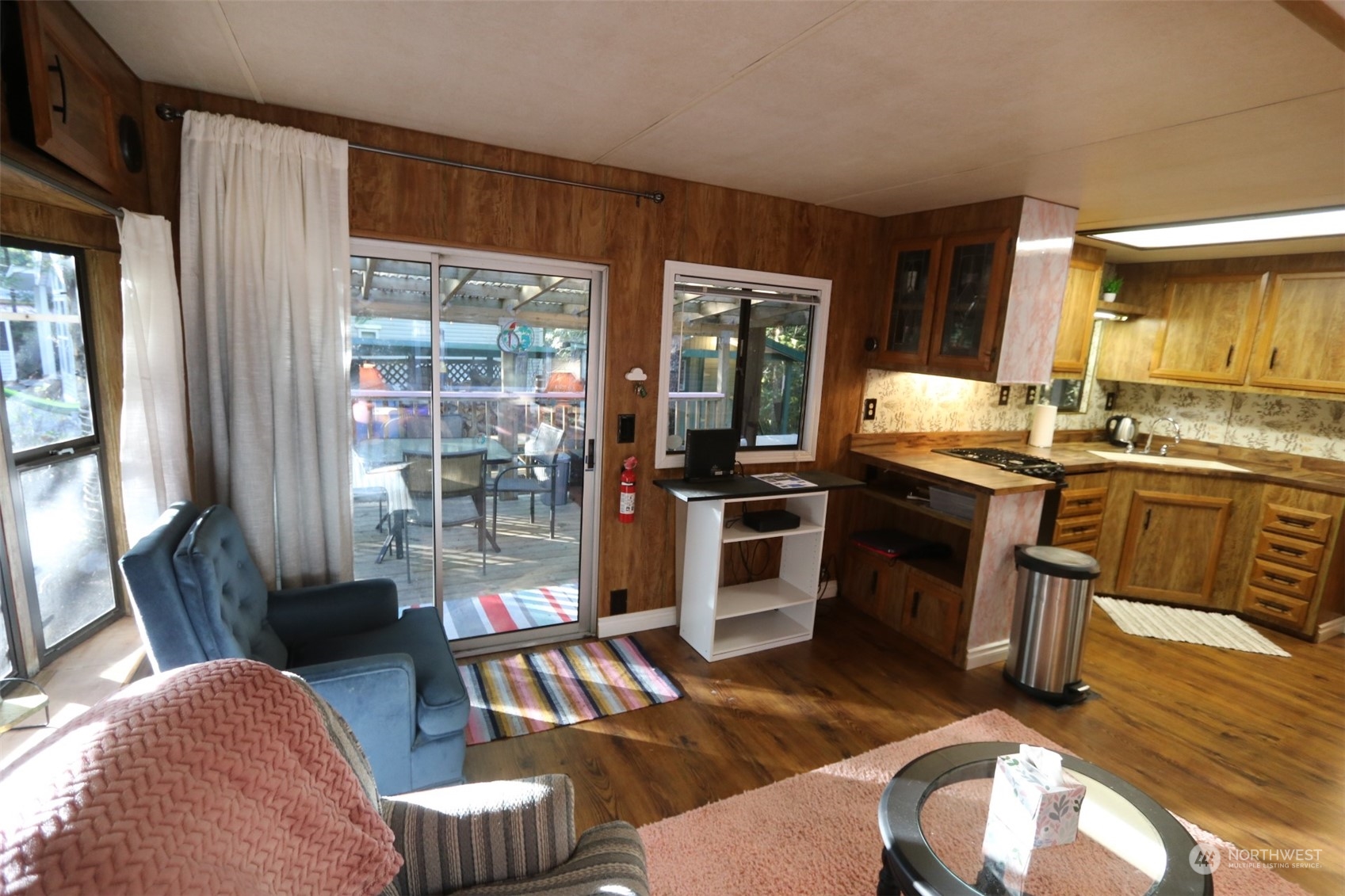 18 Drial Loop Maple Falls, WA 98266 - Photo 18 of 39 a living room with furniture a large window and stainless steel appliances