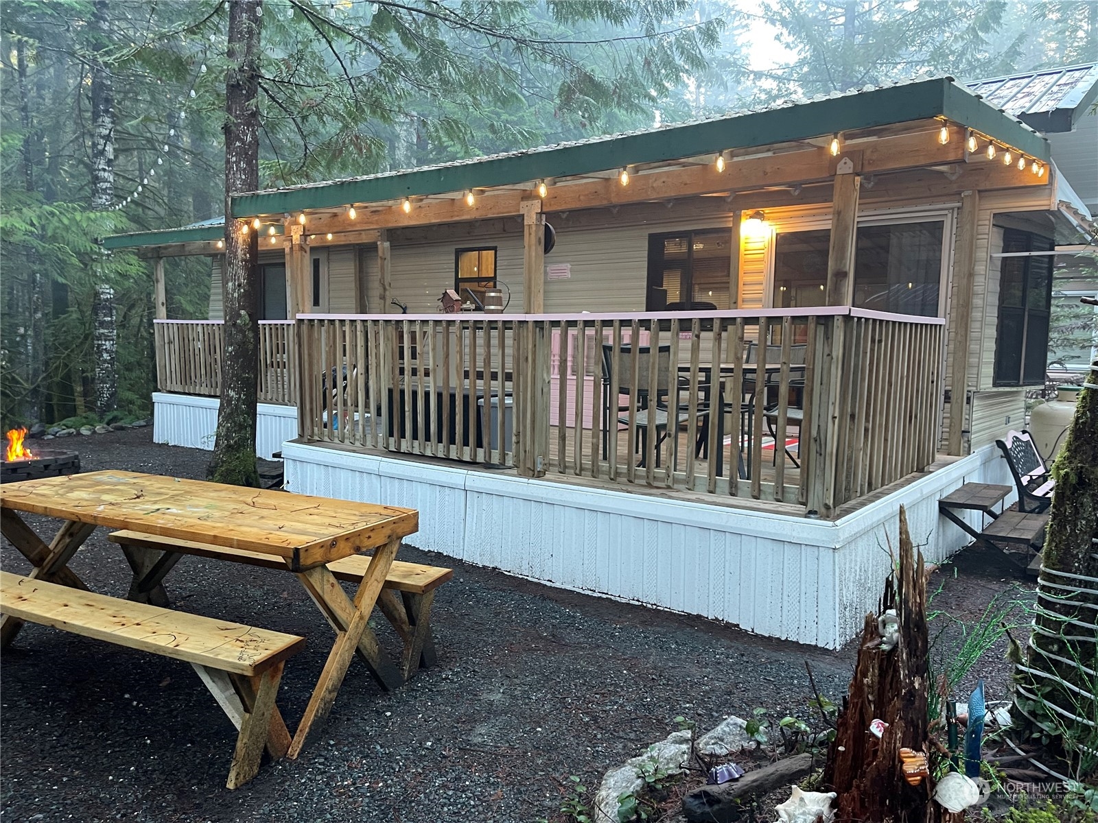 18 Drial Loop Maple Falls, WA 98266 - Photo 9 of 39 a view of backyard with deck and outdoor seating