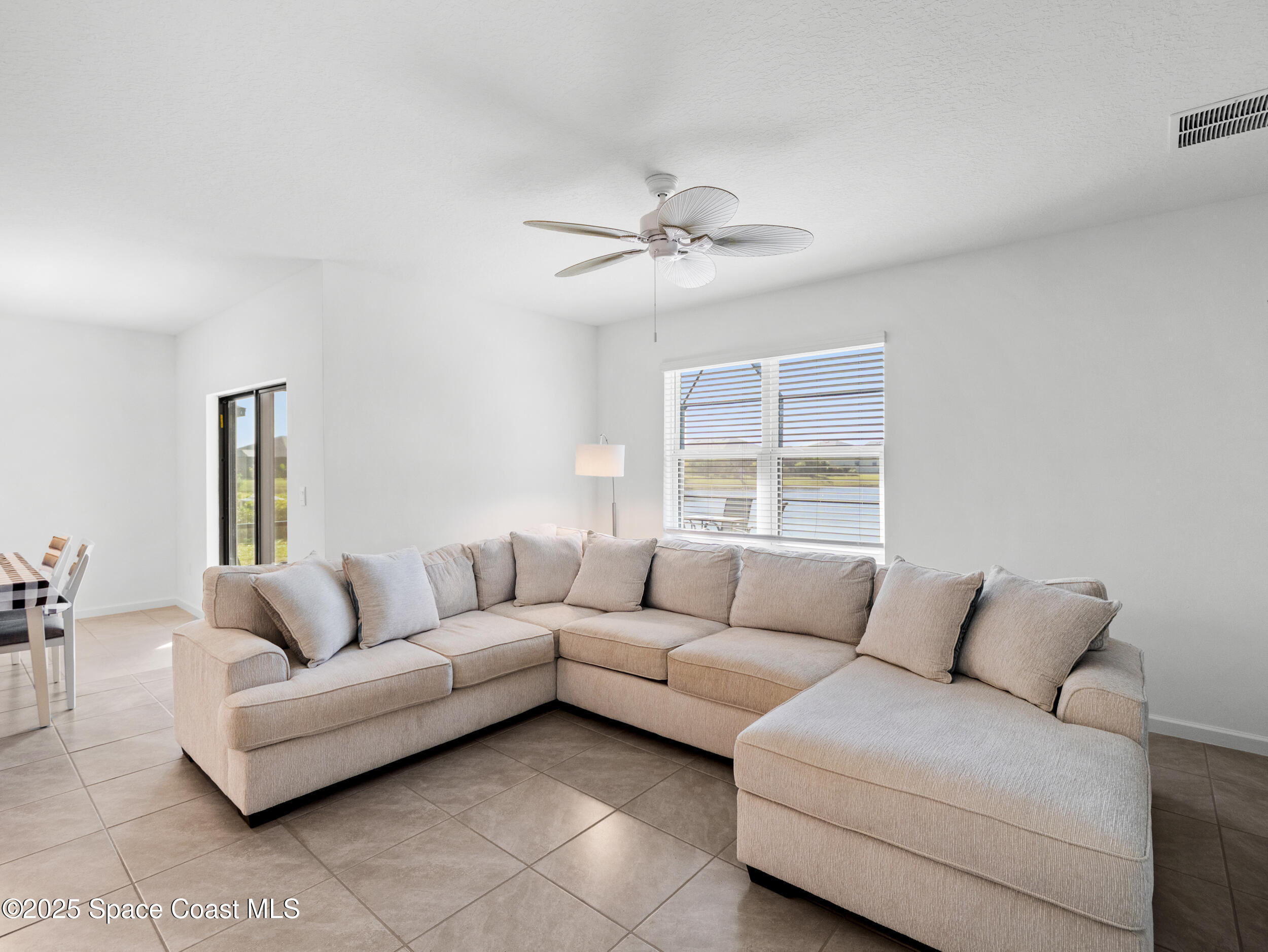 5678 Waterfall Place Grant, FL 32949 - Photo 12 of 25 a living room with furniture and a large window