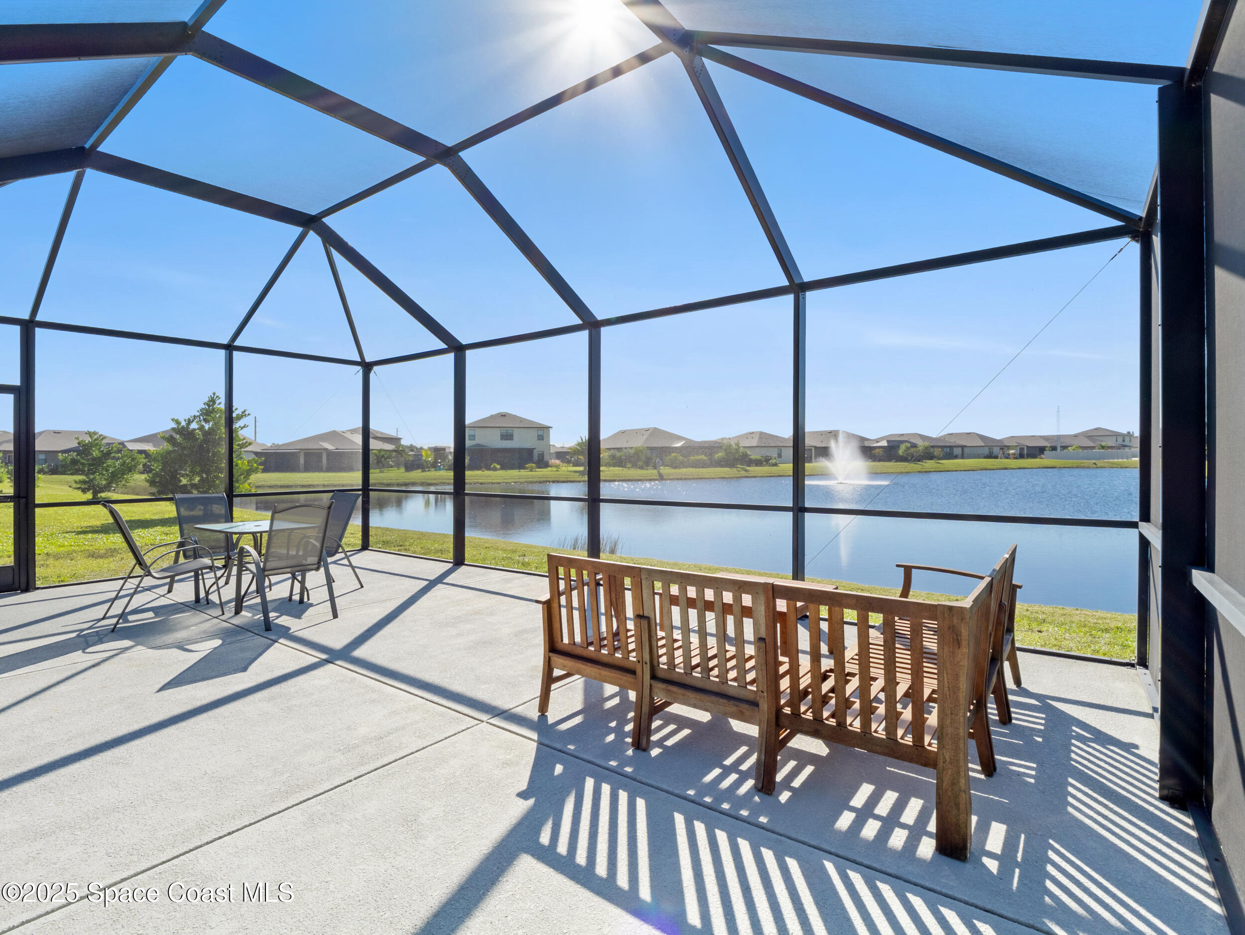 5678 Waterfall Place Grant, FL 32949 - Photo 21 of 25 a view of a balcony with lake view and a large window