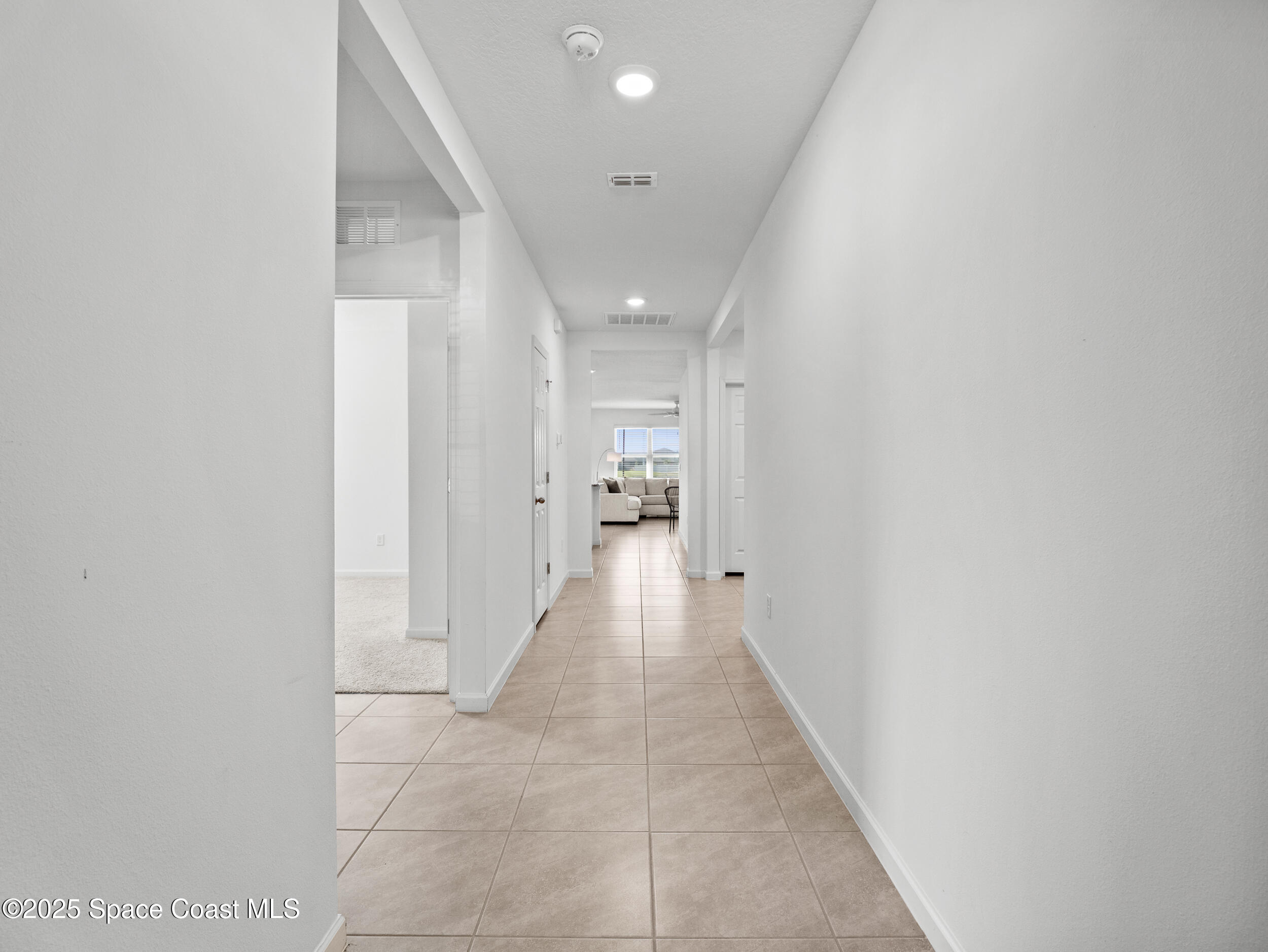 5678 Waterfall Place Grant, FL 32949 - Photo 3 of 25 a view of a hallway with wooden shelves