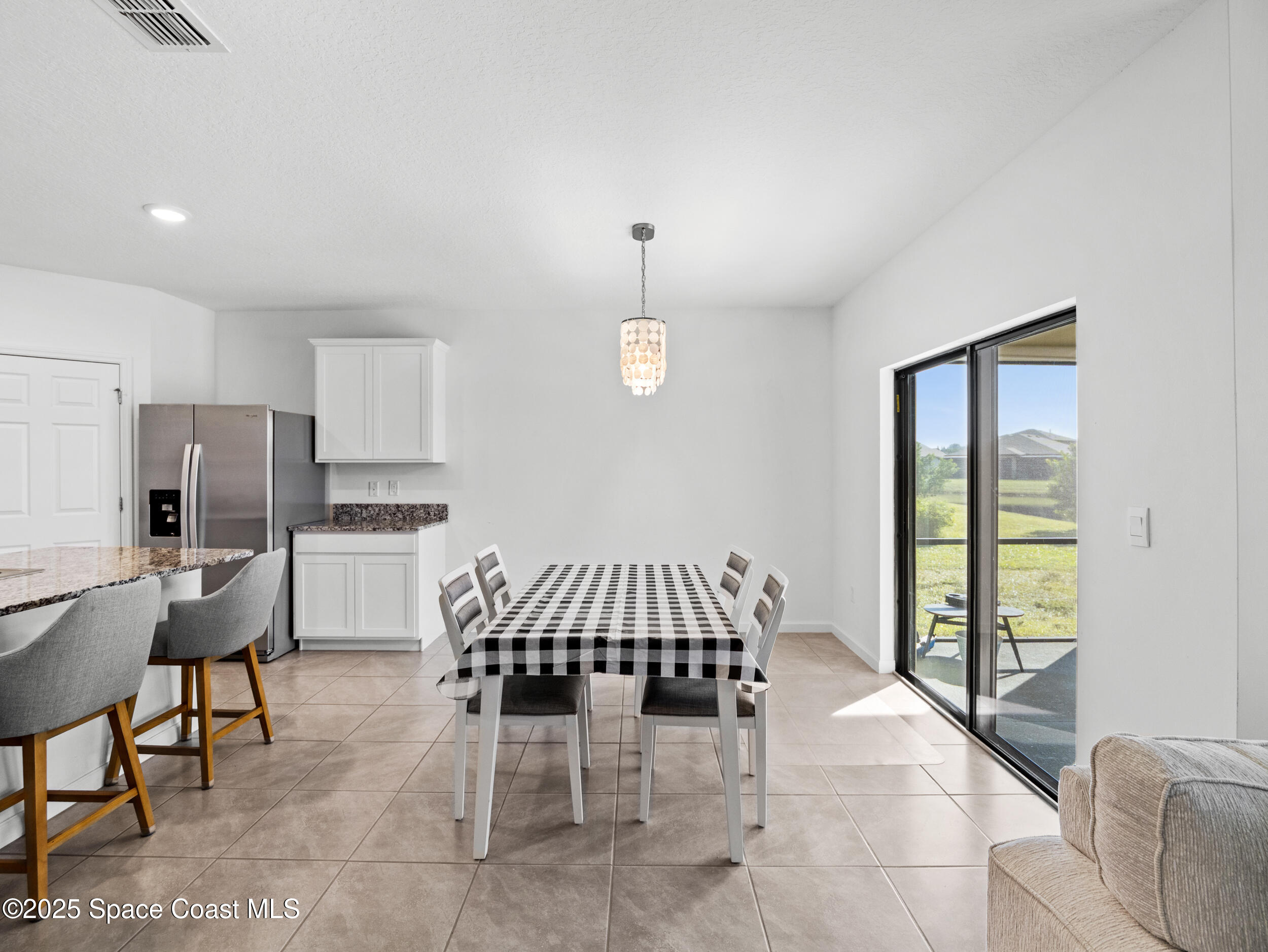 5678 Waterfall Place Grant, FL 32949 - Photo 8 of 25 a view of a dining room with furniture