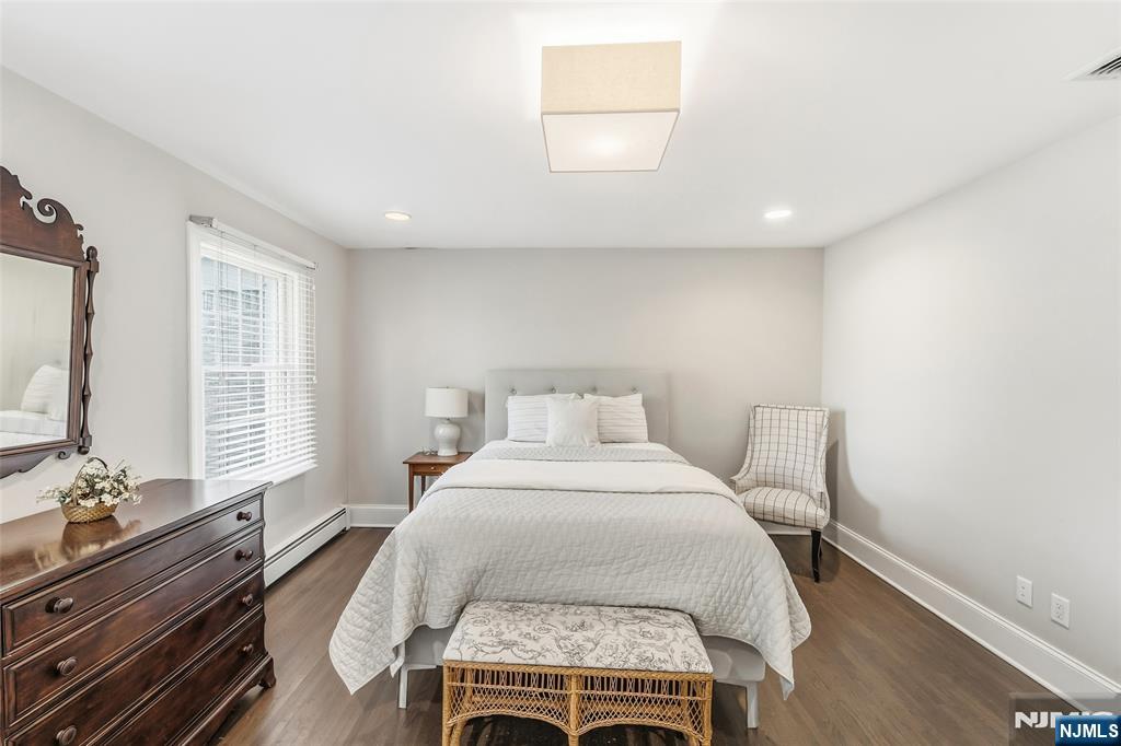 27 Pine Hill Road Old Tappan, NJ 07675 - Photo 42 of 50 a bed room with a bed and a night stand