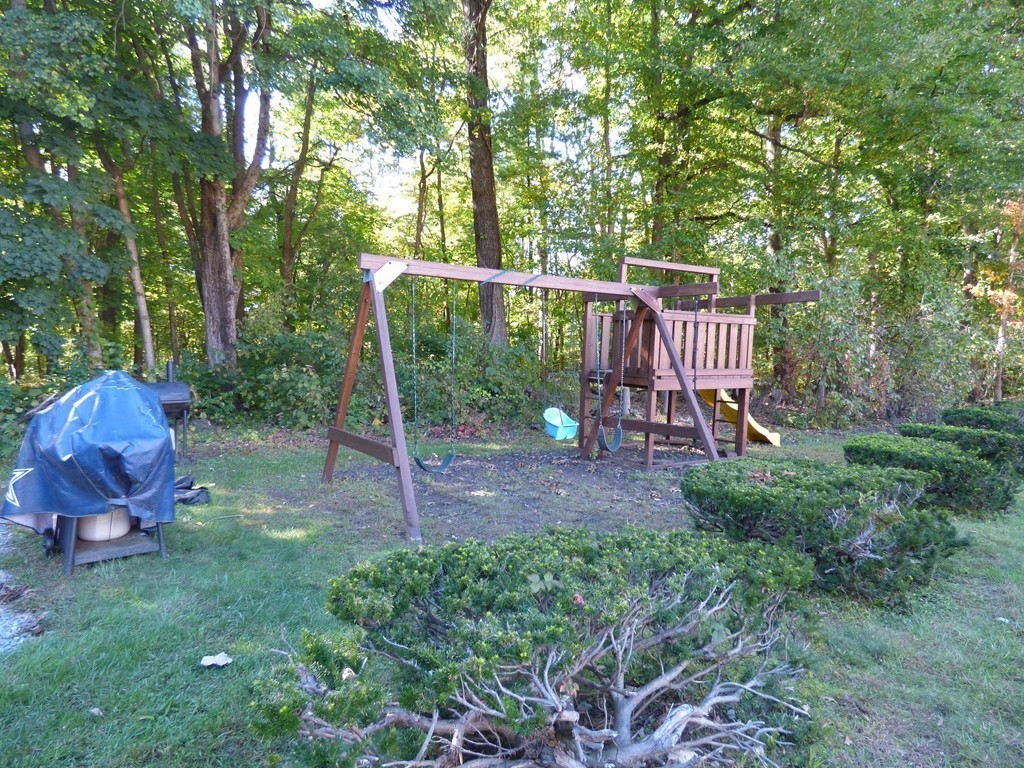 2 Leonard Road, Unit 2 Boxborough, MA 01719 - Photo 14 of 17 a view of a chair and table in the garden