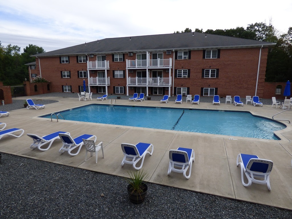 2 Leonard Road, Unit 2 Boxborough, MA 01719 - Photo 4 of 17 a view of outdoor space with plants and wooden fence