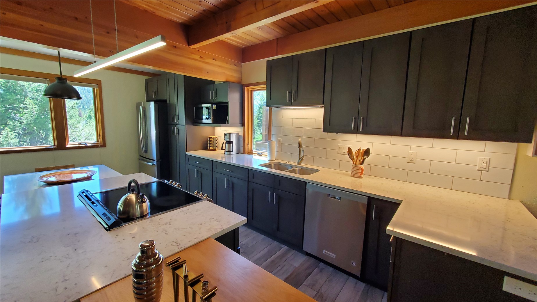 620 Tennis Club Road, Unit 1337 Keystone, CO 80435 - Photo 3 of 48 a kitchen with a sink cabinets and wooden floor