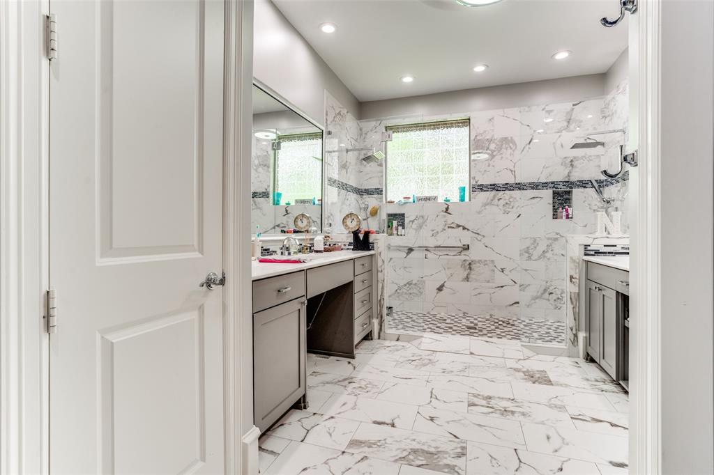 1912 Surrey Lane McKinney, TX 75072 - Photo 18 of 38 a bathroom with a sink a toilet and shower