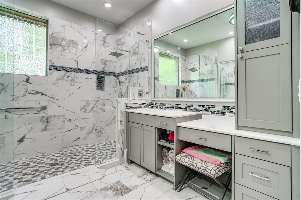 1912 Surrey Lane McKinney, TX 75072 - Photo 19 of 38 a bathroom with a sink a vanity and a mirror