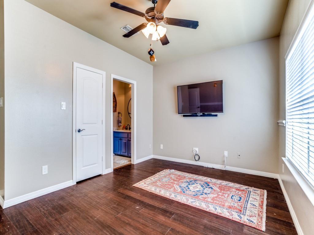 1912 Surrey Lane McKinney, TX 75072 - Photo 22 of 38 a view of a room with wooden floor and ceiling fan