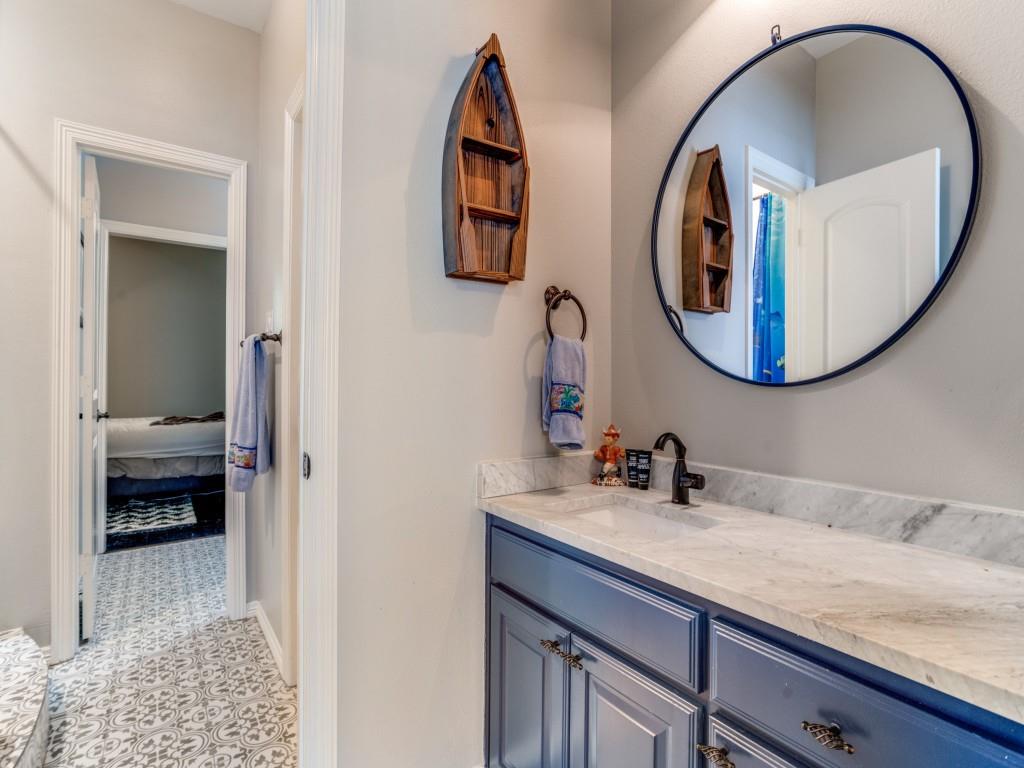 1912 Surrey Lane McKinney, TX 75072 - Photo 23 of 38 a bathroom with a sink and a mirror