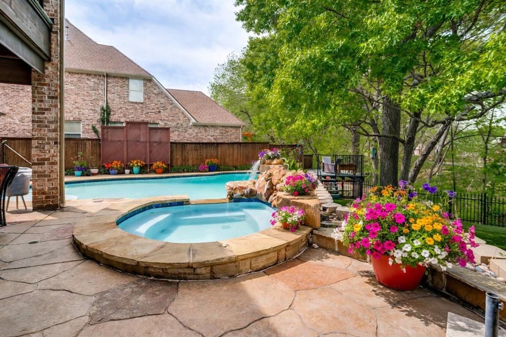 1912 Surrey Lane McKinney, TX 75072 - Photo 28 of 38 a view of a swimming pool with sitting area