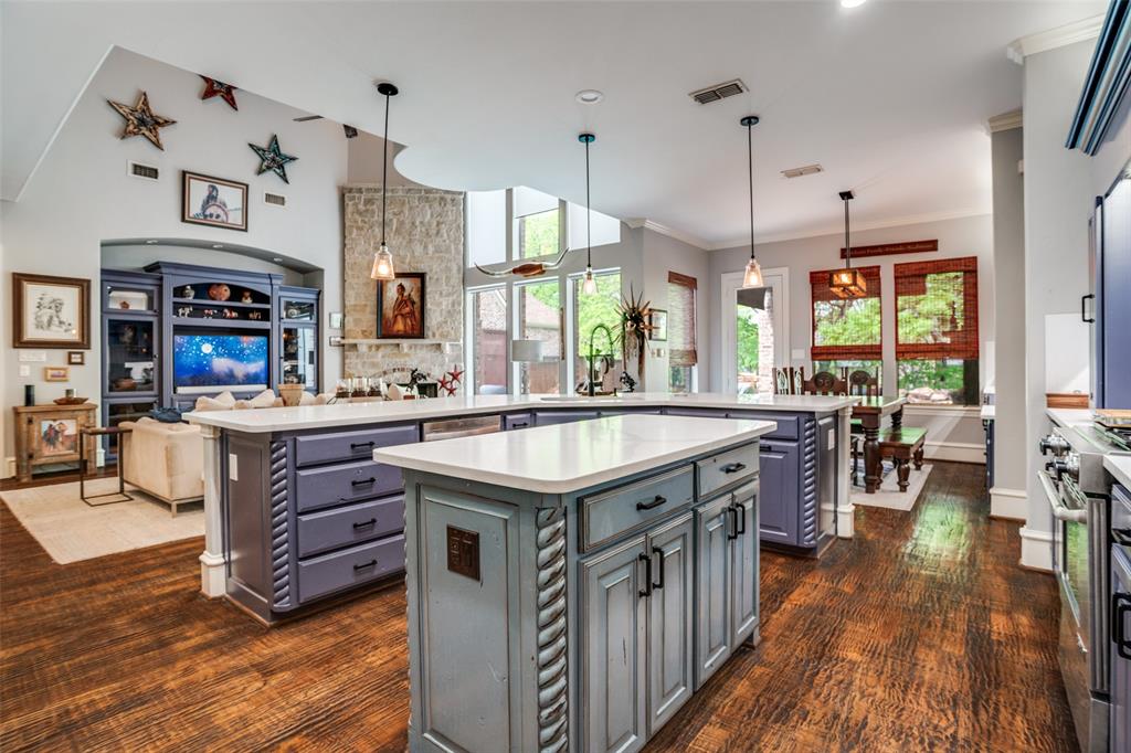 1912 Surrey Lane McKinney, TX 75072 - Photo 6 of 38 a kitchen with counter space wooden floor and window