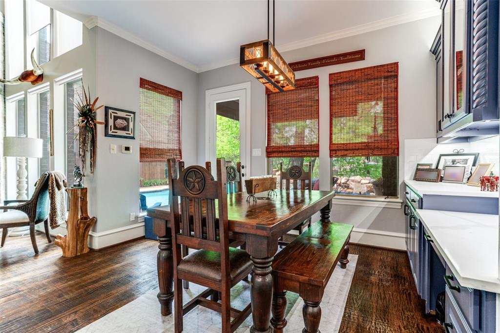 1912 Surrey Lane McKinney, TX 75072 - Photo 8 of 38 a view of a dining room with furniture window and wooden floor