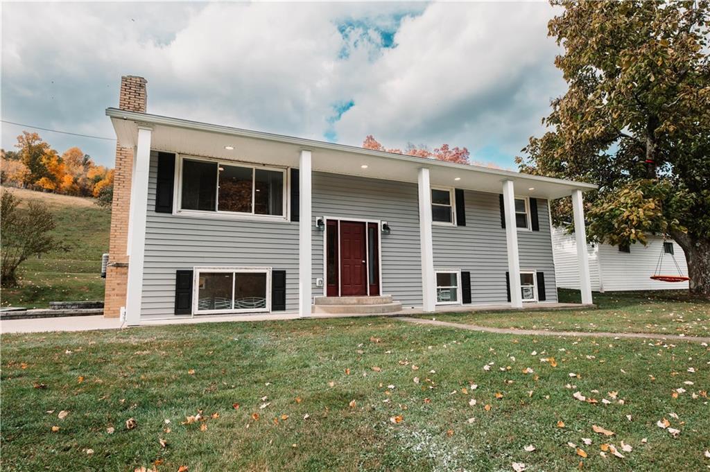 153 McMillen Road Home, PA 15747 - Photo 21 of 25 a front view of a house with a garden