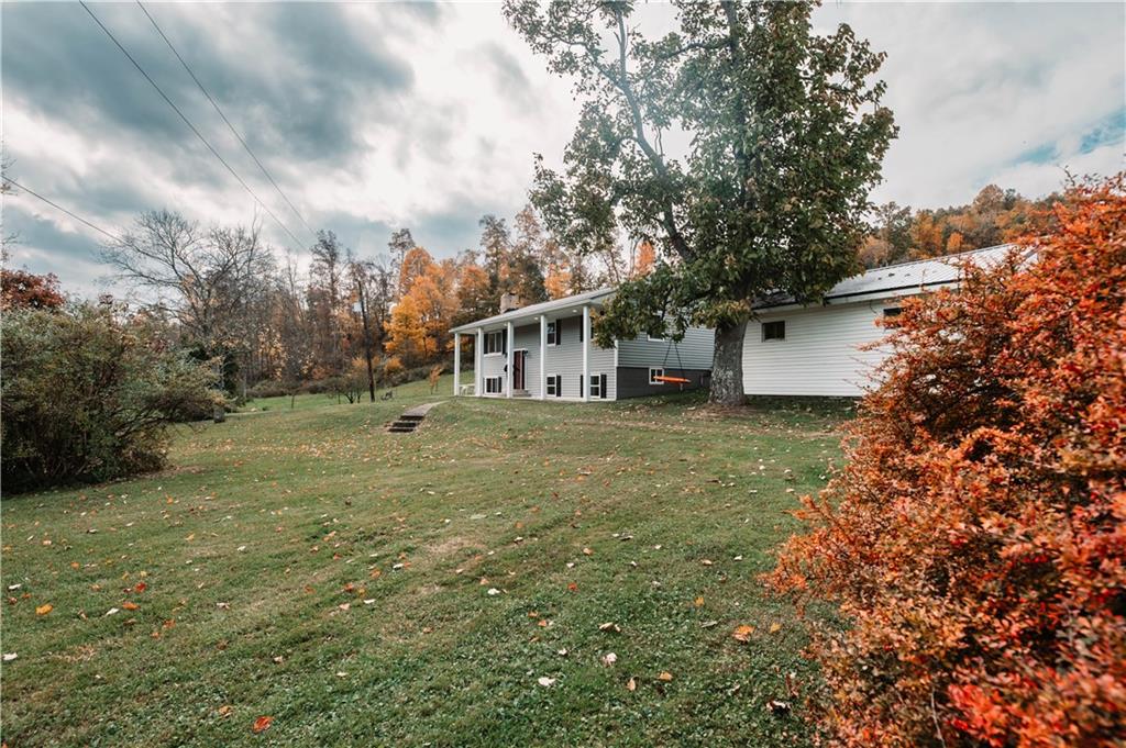 153 McMillen Road Home, PA 15747 - Photo 3 of 25 a house view with a garden space