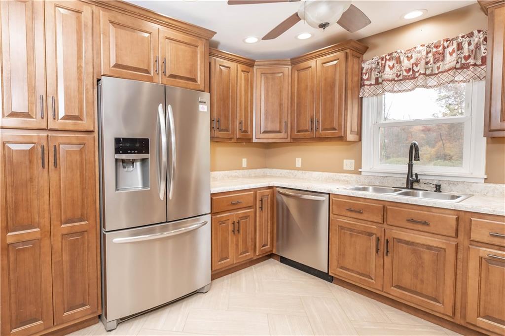 153 McMillen Road Home, PA 15747 - Photo 5 of 25 a kitchen with appliances a sink and a window