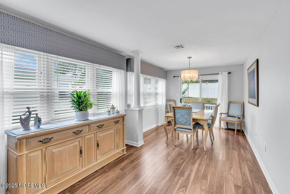 16 Thames Place Brick, NJ 08723 - Photo 13 of 28 a kitchen with white cabinets and wooden floor