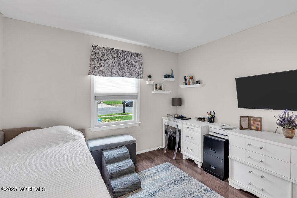 16 Thames Place Brick, NJ 08723 - Photo 17 of 28 a bedroom with a bed and a flat screen tv