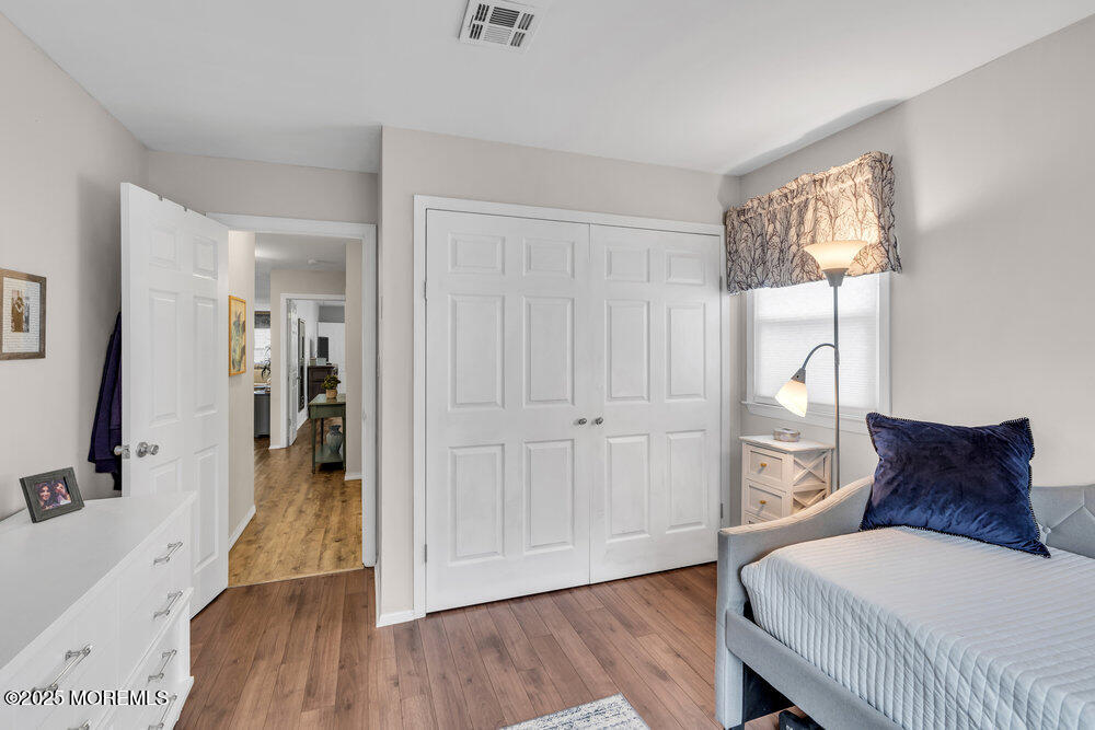 16 Thames Place Brick, NJ 08723 - Photo 18 of 28 a bedroom with a bed and a wooden floor