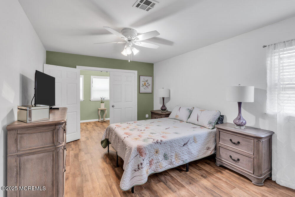 16 Thames Place Brick, NJ 08723 - Photo 19 of 28 a bedroom with a bed and a flat screen tv
