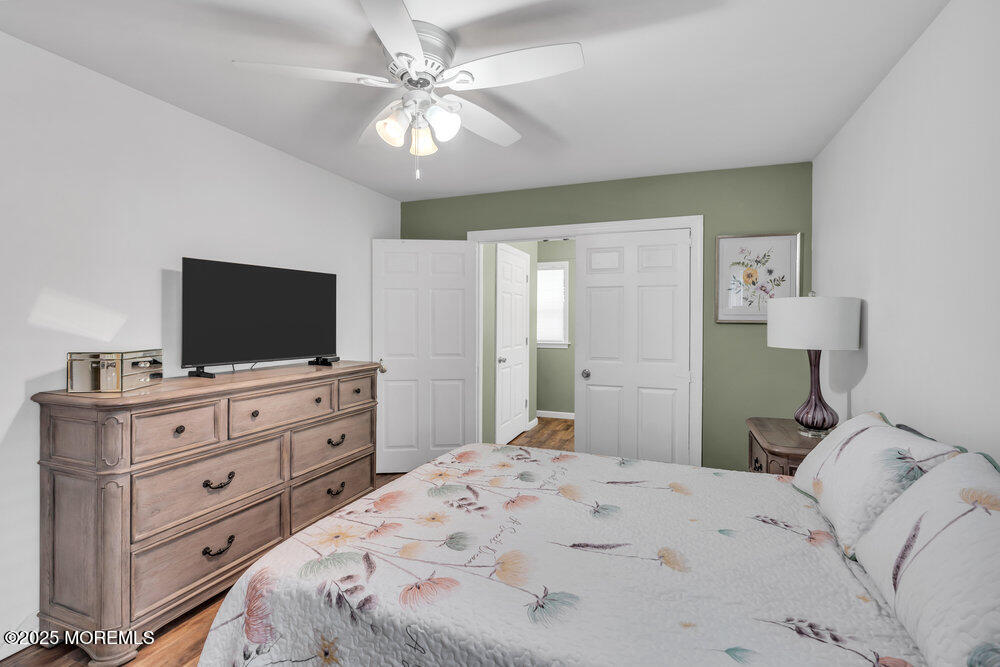 16 Thames Place Brick, NJ 08723 - Photo 20 of 28 a bedroom with a bed and a flat screen tv in it