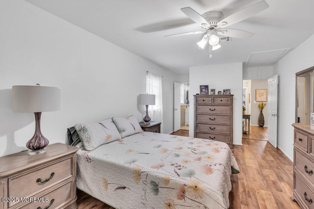 16 Thames Place Brick, NJ 08723 - Photo 21 of 28 a bedroom with a large bed and a chandelier