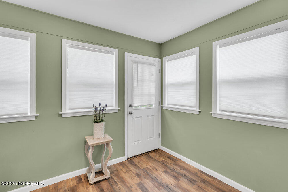 16 Thames Place Brick, NJ 08723 - Photo 22 of 28 a view of an empty room with wooden floor and a window